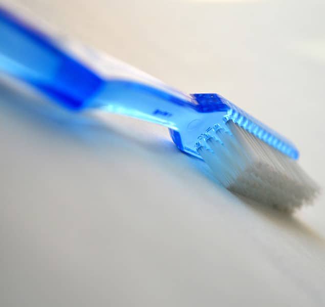 Close up of a blue tooth brush