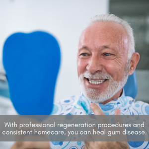 Senior man looking in the mirror at his teeth at a dental office