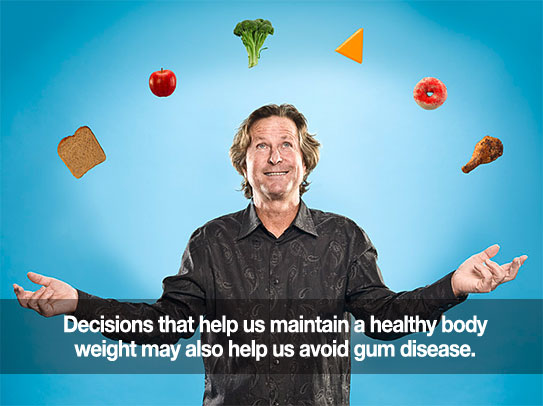 Man juggling food. Caption: Decisions that help us maintain a healthy body weight also help avoid gum disease.