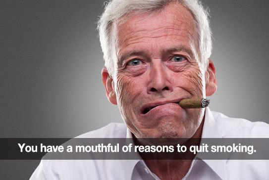 Old wrinkly man smoking a cigar