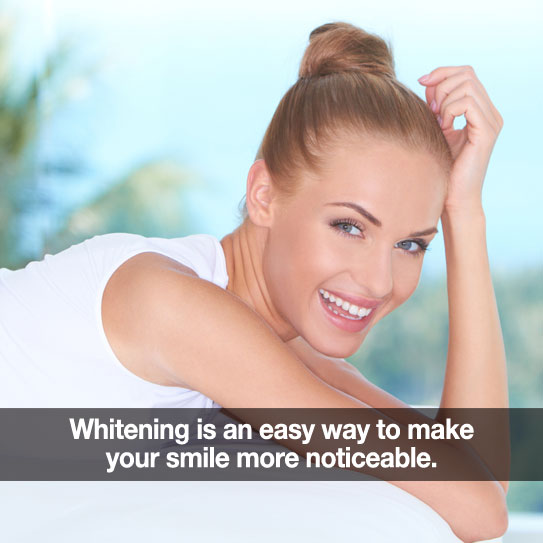 Beautiful woman smiling. Caption: Teeth whitening makes your smile more noticeable