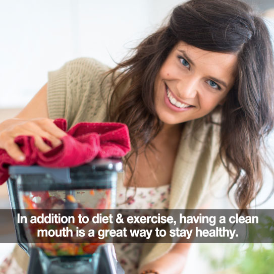 Woman using a blender. Caption: In addition to diet & exercise, having a clean mouth is a great way to stay healthy.