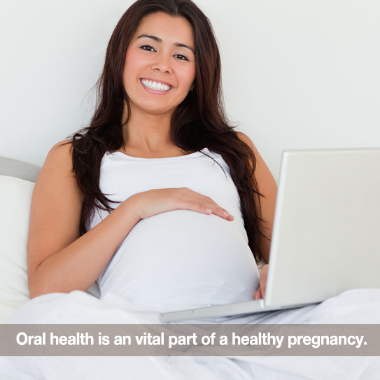 Woman pregnant in bed. Caption: Oral health is a vital part of a healthy pregnancy.