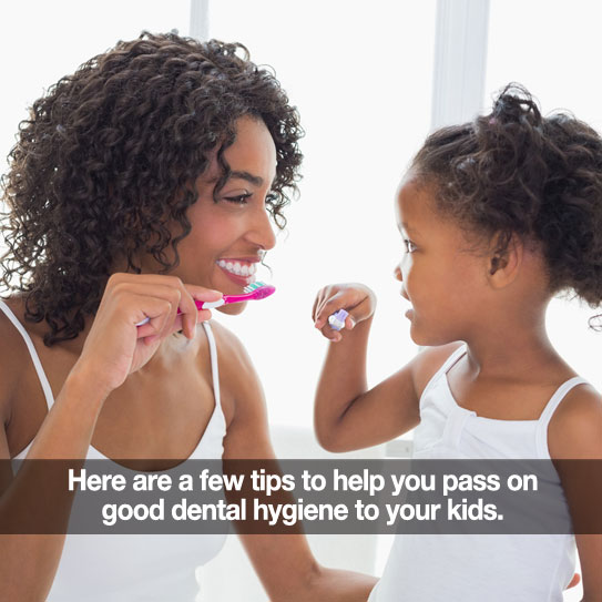 Mother and young daughter brushing their teeth together