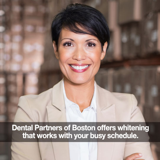 Woman smiling. Caption: Dental Partners of Boston offers teeth whitening