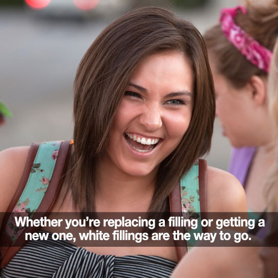 Woman smiling big. Caption: White fillings are the way to go.