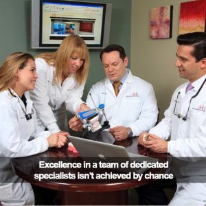 Team of dentists around a table