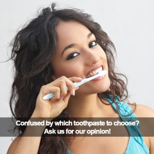 Woman brushing her teeth. Caption: Confused by which toothpaste to choose?