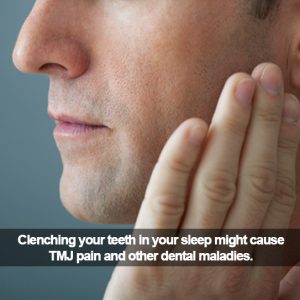 A man holding his cheek. Caption: Clenching your teeth in your sleep might cause YMJ pain.