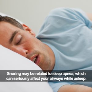 Man sleeping. Caption: Snoring may be related to sleep apnea