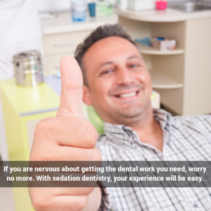 Male patient giving thumbs up in dental chair