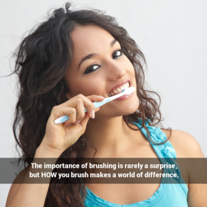 A beautiful young woman brushing her teeth