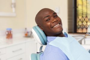 A man gets regular dental checkups in Boston