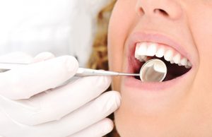 Woman getting an oral cancer screening