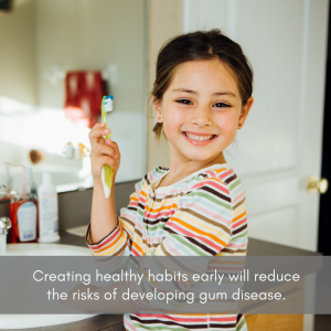 Young girl preventing gum disease by brushing her teeth.