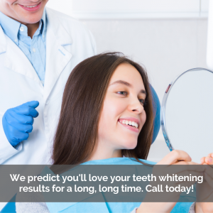 A girl gets teeth whitening treatment. She looks at her smile in a mirror.