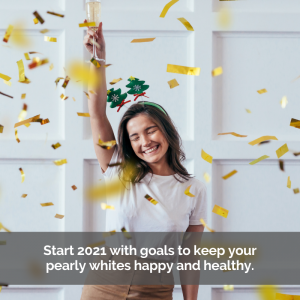 Keep good dental health in 2021. Woman celebrates with wine and confetti.