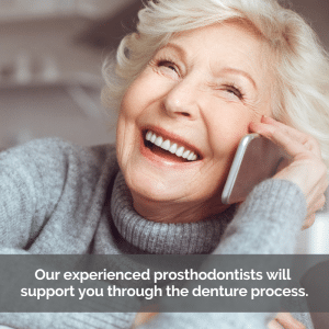 Senior woman smiles confidently with dentures while talking on the phone