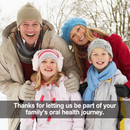 Happy family in winter clothes.