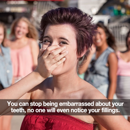 Woman covering her mouth. Caption: Don't be embarrassed by your fillings with white fillings.