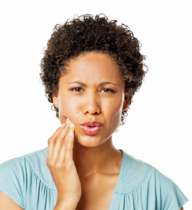 Woman holding her cheek in pain