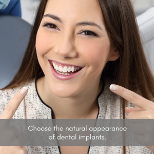 Woman at dental office smiling and pointing at teeth