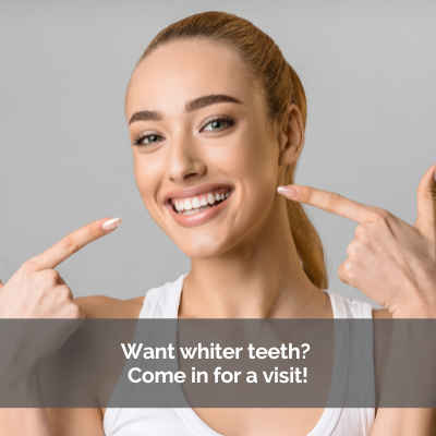 Young woman pointing at her teeth, Caption: Want whiter teeth? Come in for a visit!