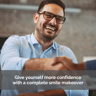 Complete smile makeover. Man smiling big and shaking hands with another person.