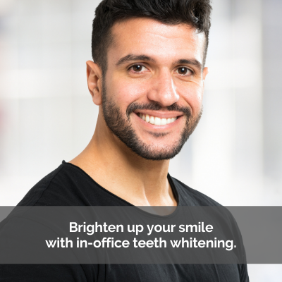Man smiling. Caption: Brighten up your smile with in-office teeth whitening.