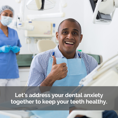 Man in dental chair giving a thumbs up. Caption: Let's address your dental anxiety.