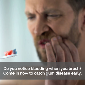 Man holding his cheek in pain. Catch gum disease early.