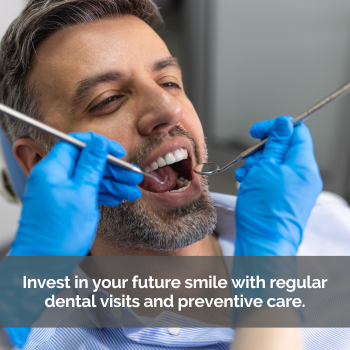 Man at the dentists with mouth open, dentist holding tools near patient's mouth, getting teeth cleaned.