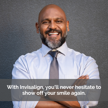Man smiling, folded arms. Caption: With Invisalign, you'll never hesitate to show off your smile again.
