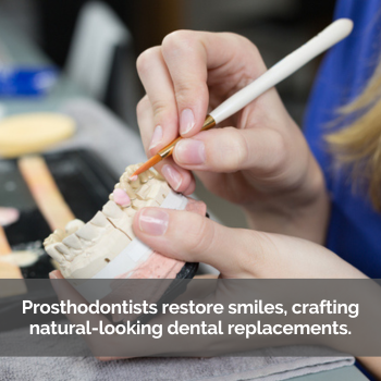 Dentist working on tooth mold. Caption: Prosthodontists restore smiles