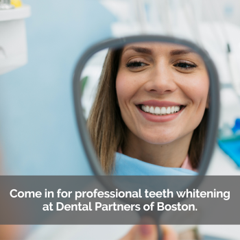 Woman smiling in a hand mirror. Caption: Come in for professional teeth whitening at Dental Partners of Boston