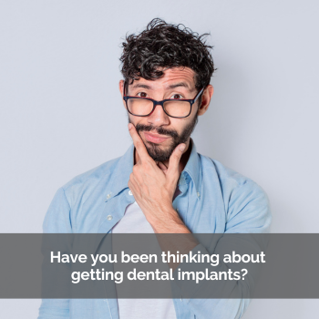 Man with a beard and glasses looking like he's thinking. Caption: Have you been thinking about dental implants
