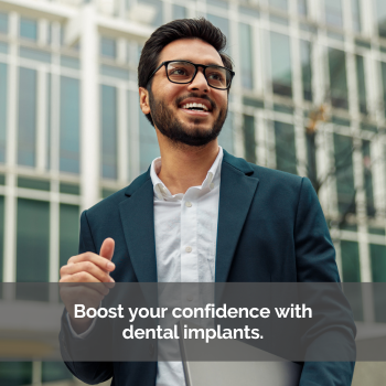 Dental implant: man in a business suit smiling