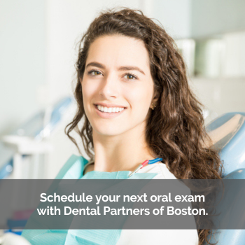 Woman sitting in a dental chair. Caption: Schedule your next oral exam