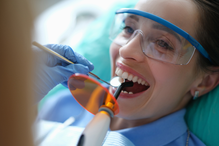 Woman getting restorative dental treatment